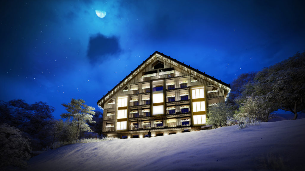 Chalet Himalaya di sera, con le vetrate illuminate e la neve intorno